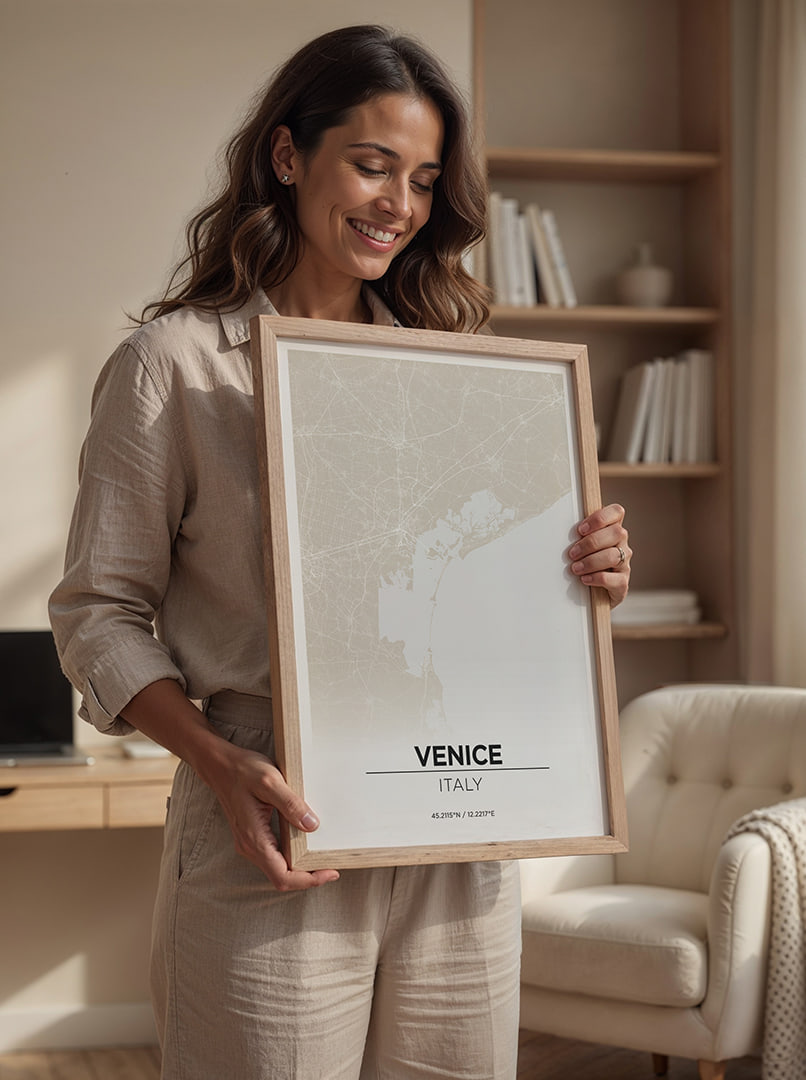 Person holding a framed map of Venice, Italy