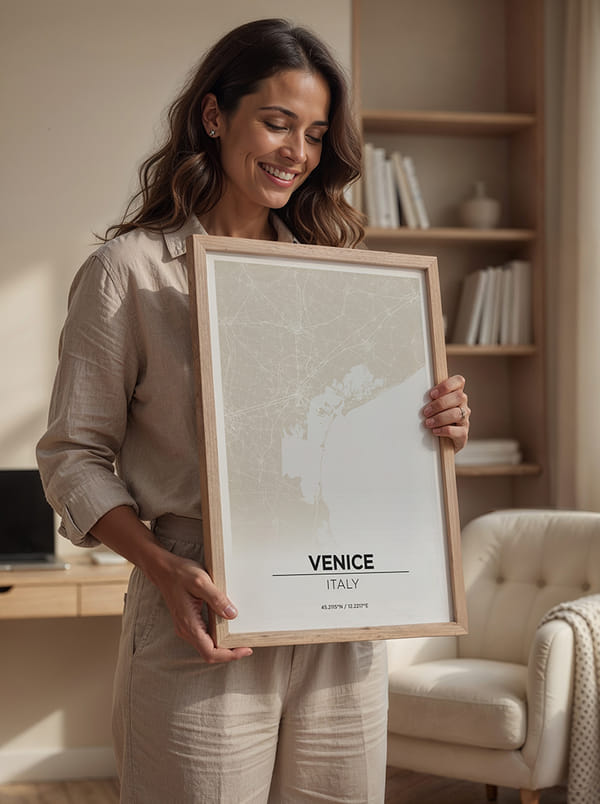 Person holding a framed map of Venice, Italy