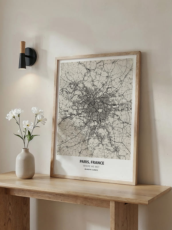 Framed map poster of Paris on a wooden table with flowers