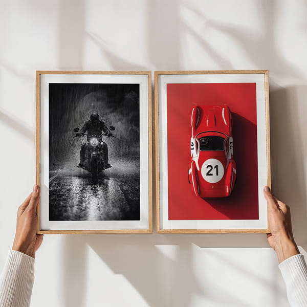 Mur de photos avec deux affiches en noir et blanc et rouge Perfect Pair Ferrari Le Mans And Motorcycle poster wall