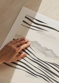 A woman looks out over abstract landscape in black and white-9