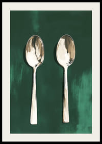 Two stylish spoons against a deep green background-2