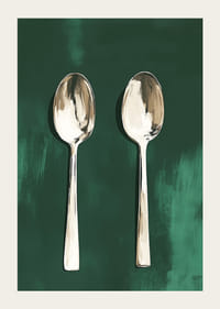 Two stylish spoons against a deep green background-3