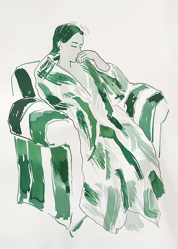 A woman in green harmony, calmly sunk in an armchair-12