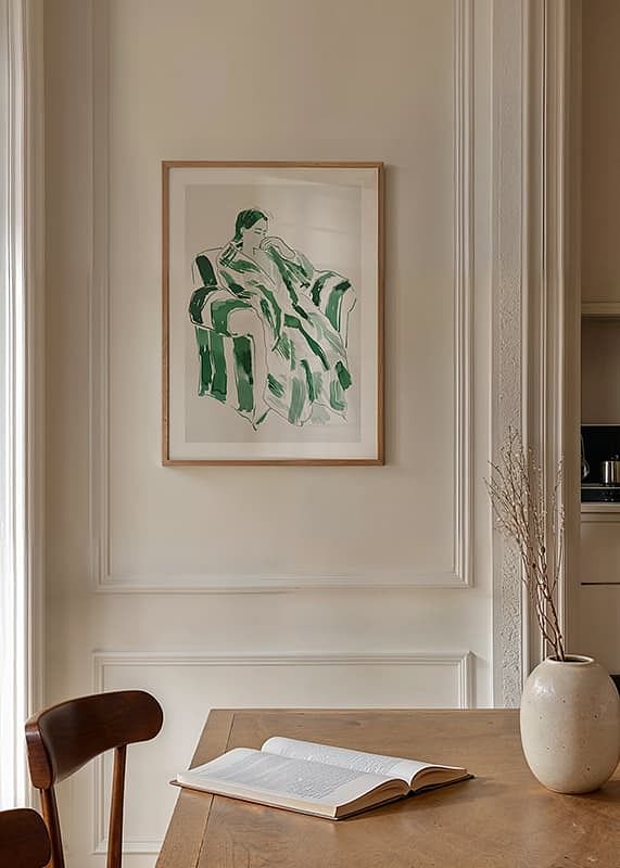A woman in green harmony, calmly sunk in an armchair-12