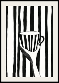 A hand holds a striped cup in black and white pattern-2