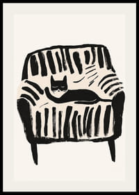A black and white cat rests peacefully in the soft lines of the armchair-2