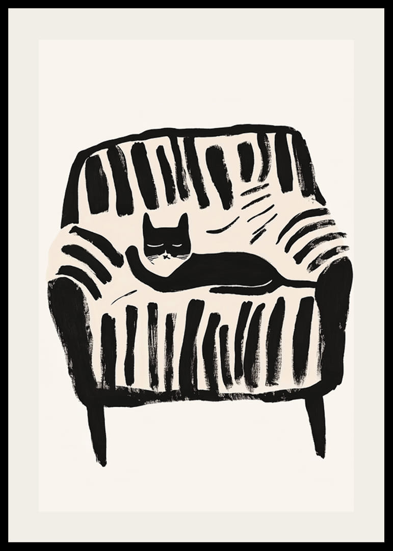 A black and white cat rests peacefully in the soft lines of the armchair-12