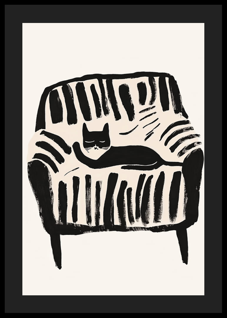 A black and white cat rests peacefully in the soft lines of the armchair-12