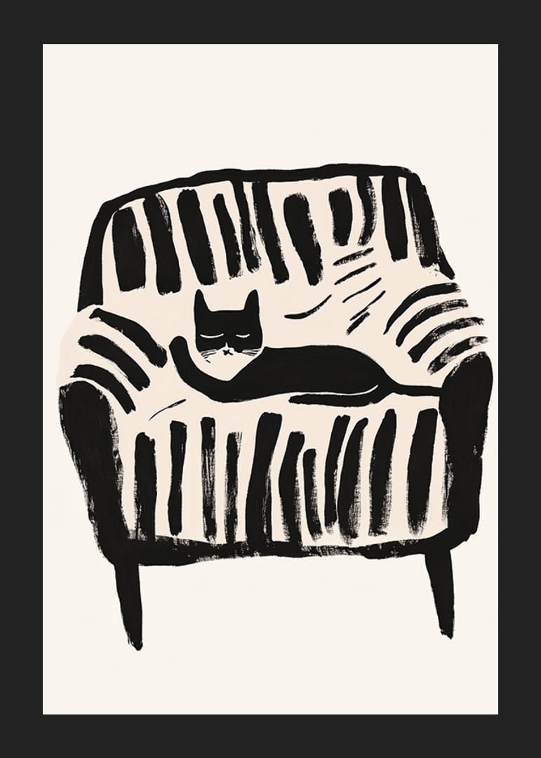 A black and white cat rests peacefully in the soft lines of the armchair-12