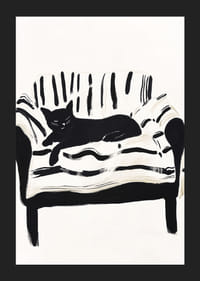 En katt ligger lugnt på en randig soffa och skapar en harmonisk känsla-5