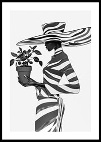 An elegant silhouette in black and white with a plant in her hand-0