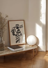 An elegant silhouette in black and white with a plant in her hand-8