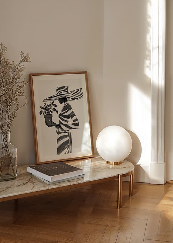 An elegant silhouette in black and white with a plant in her hand-12
