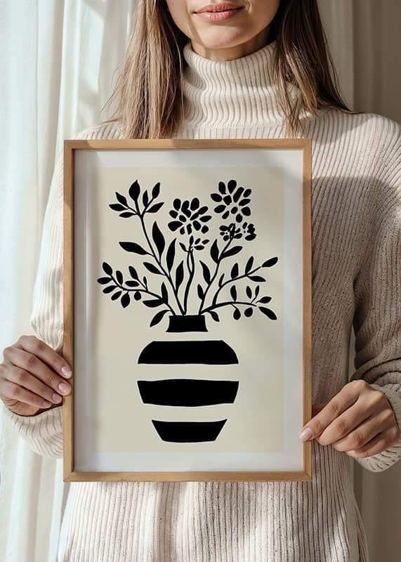 En elegant silhuet af blomster i en sort og hvid vase-12