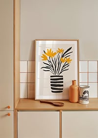 Yellow flowers in a stylish striped vase spread joy-8