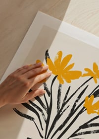 Yellow flowers in a stylish striped vase spread joy-9