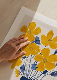 Golden flowers in a blue striped vase bring the room to life-9