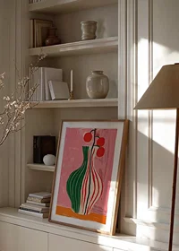 A colorful vase with stripes on a pink background-2