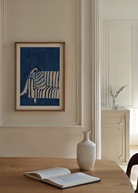 Deep blue envelops a resting figure in a striped cover-8