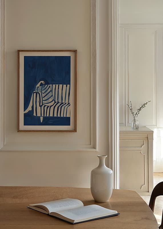 Deep blue envelops a resting figure in a striped cover-12