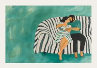 A couple rests together on a striped sofa, filled with harmony-3