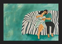 A couple rests together on a striped sofa, filled with harmony-5