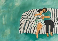 A couple rests together on a striped sofa, filled with harmony-7