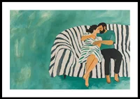 A couple rests together on a striped sofa, filled with harmony-0