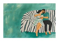 A couple rests together on a striped sofa, filled with harmony-1