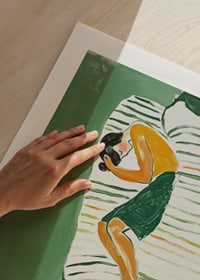 A relaxed figure rests in a harmonious green environment-9