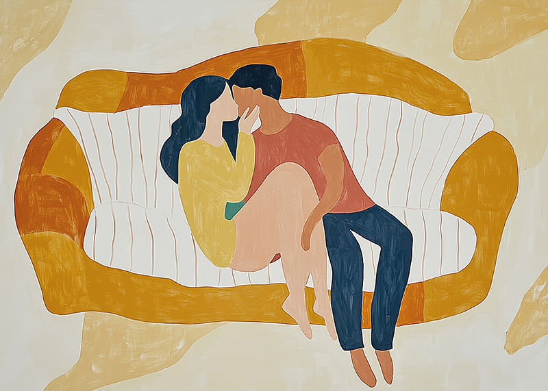 A loving couple rests on a stylized sofa in soft tones-12