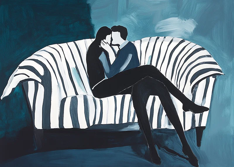Two people in an intimate embrace on a striped sofa-12