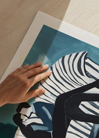 Two people in an intimate embrace on a striped sofa-9