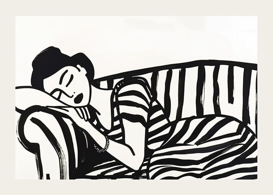 She rests dreamily on a striped sofa in monochrome elegance.-12