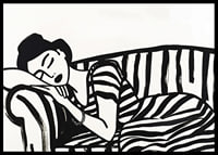 She rests dreamily on a striped sofa in monochrome elegance.-6