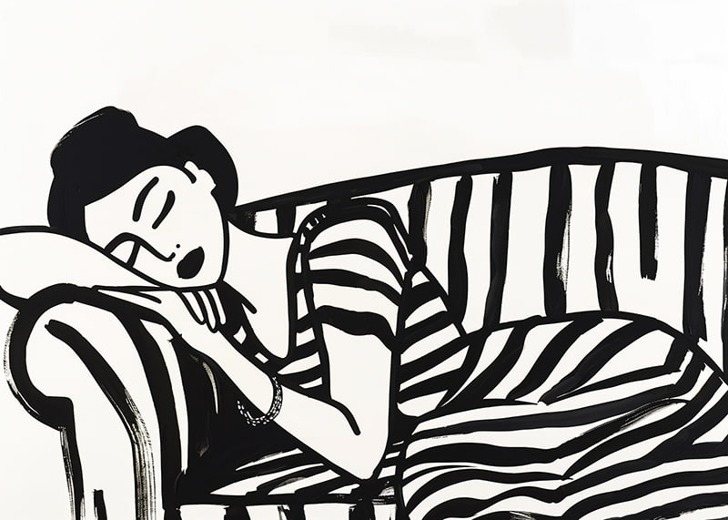She rests dreamily on a striped sofa in monochrome elegance.-12