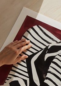Intimate silhouettes on a striped sofa against a dark background-9