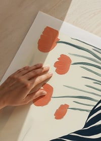 A woman rests in striped clothes surrounded by orange flowers-9