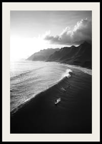 Black and white poster with surfers riding powerful waves on a dramatic coastline-2