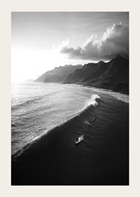 Black and white poster with surfers riding powerful waves on a dramatic coastline-3