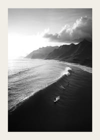 Black and white poster with surfers riding powerful waves on a dramatic coastline-3