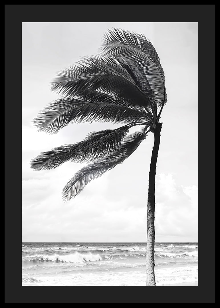 A palm tree sways softly in the winds against a stormy sea-12