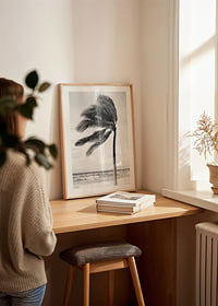 A palm tree sways softly in the winds against a stormy sea-8