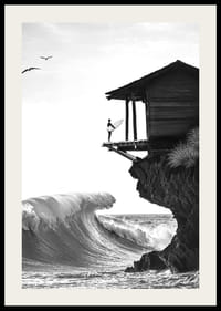 A surfer stands poised at the ocean's edge, ready to face the power of the waves-2