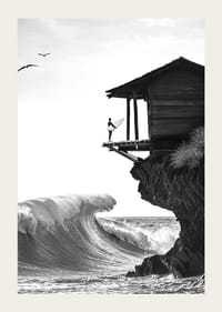 A surfer stands poised at the ocean's edge, ready to face the power of the waves-3