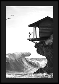 A surfer stands poised at the ocean's edge, ready to face the power of the waves-4