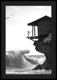 A surfer stands poised at the ocean's edge, ready to face the power of the waves-4
