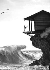 A surfer stands poised at the ocean's edge, ready to face the power of the waves-7