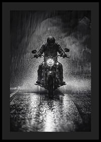 Bold motorcyclist braves the rain in dramatic scene-0